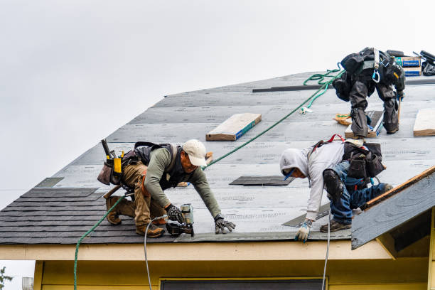 Professional Storm Damage Roof Repair technician working in Carmel, NY